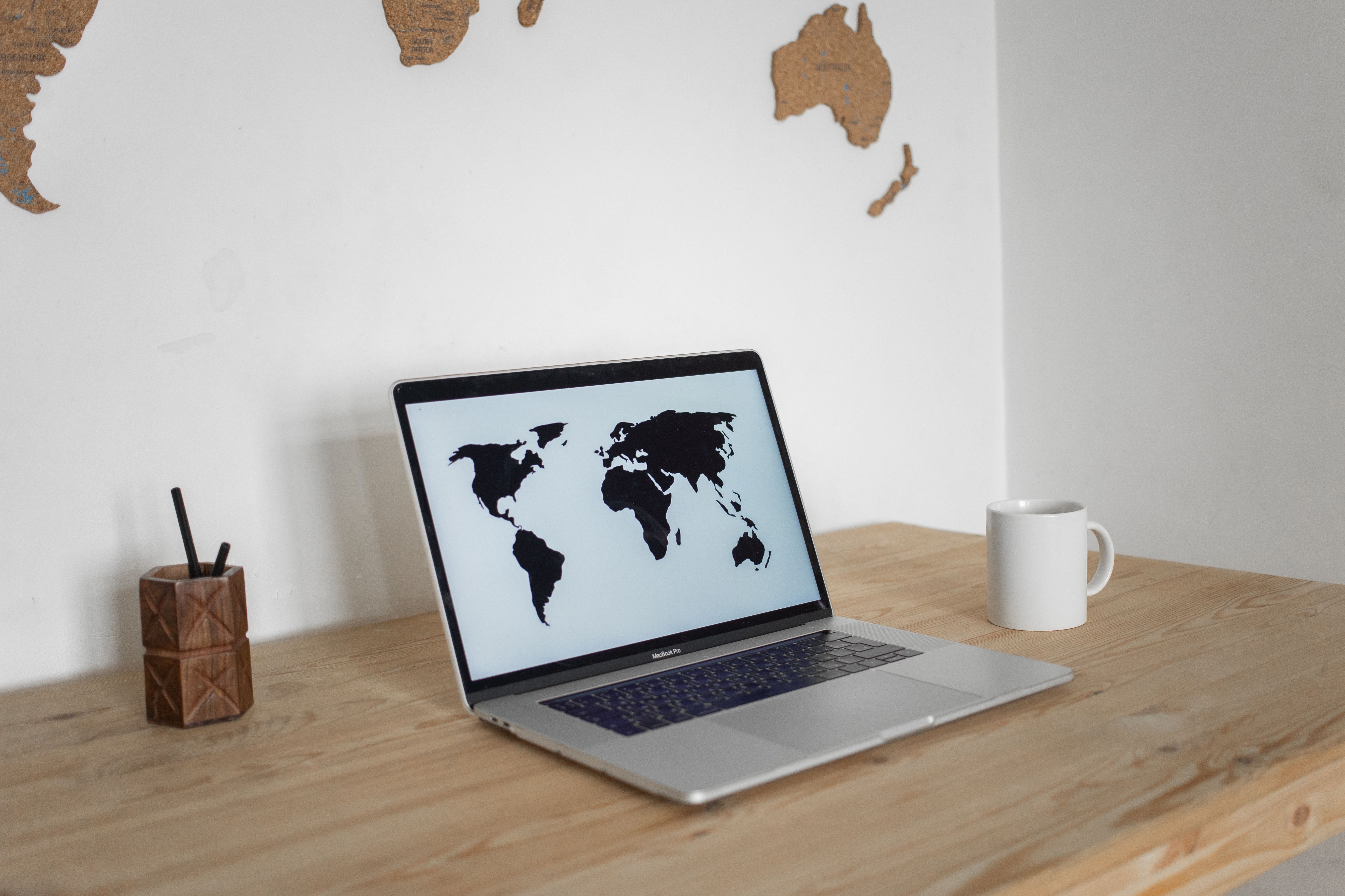 Laptop showing a world map for multilingual casino market research